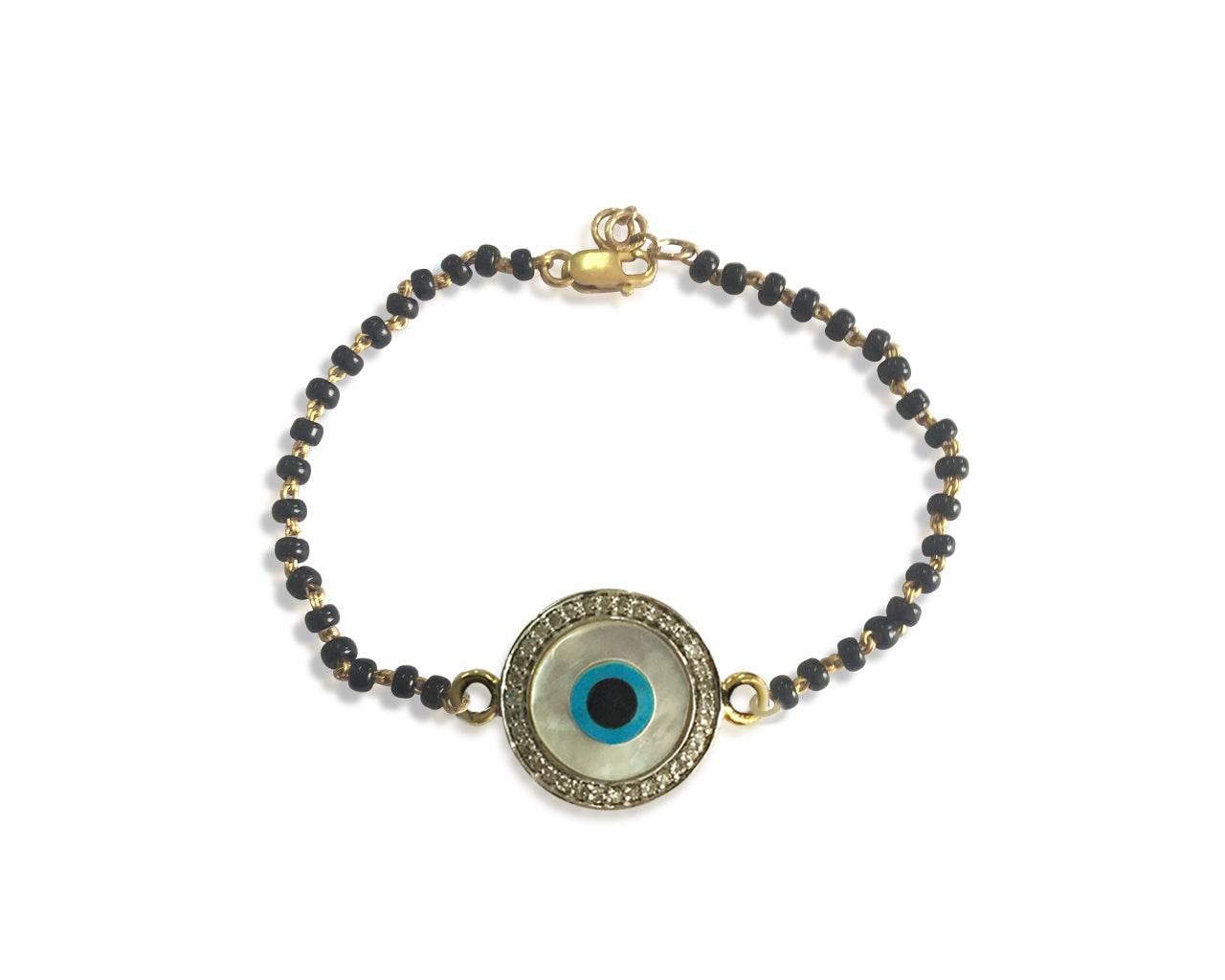 Evil eye bracelet on Mangalsutra chain in gold - Jewelslane