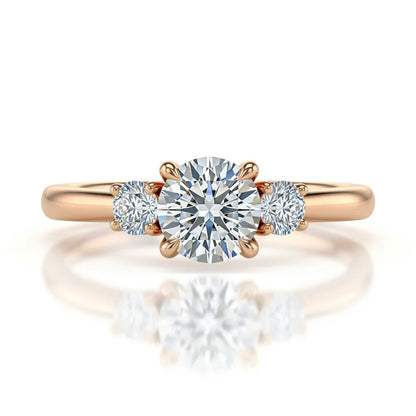 Wei Round Brilliant Cut Diamond Solitaire Ring in yellow gold, rose gold, and white gold with G color VS clarity centre flanked by two 8-cent round diamonds