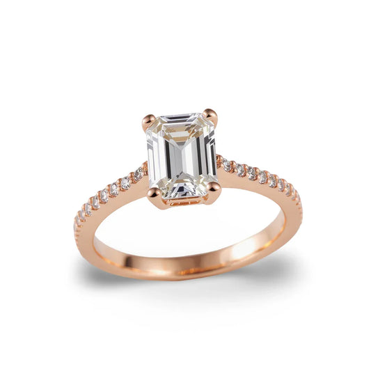 Wyna Emerald Cut Lab Diamond Solitaire Ring in yellow gold, rose gold, and white gold with 50-pointer G color centre and small diamonds on a simple shank